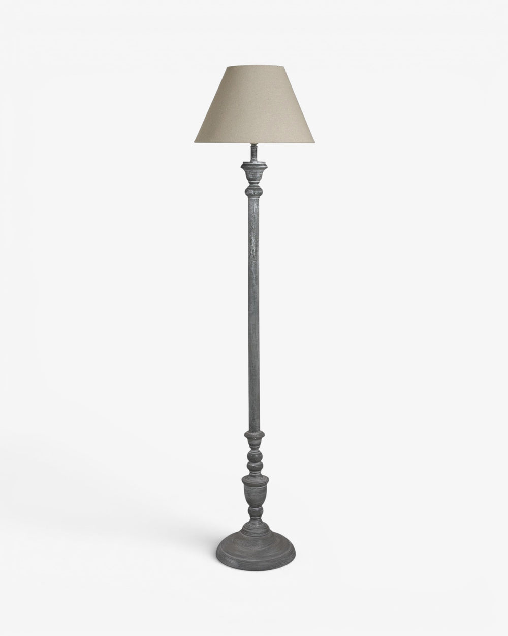 Floor lamp with a beige shade on a white background
