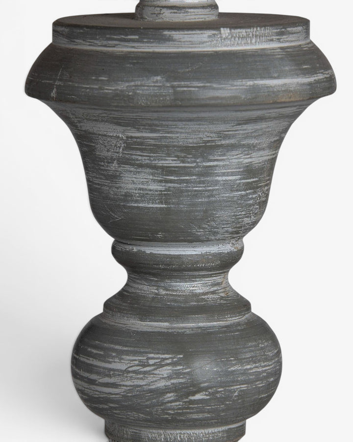 Close up of a decorative floor lamp on a white background