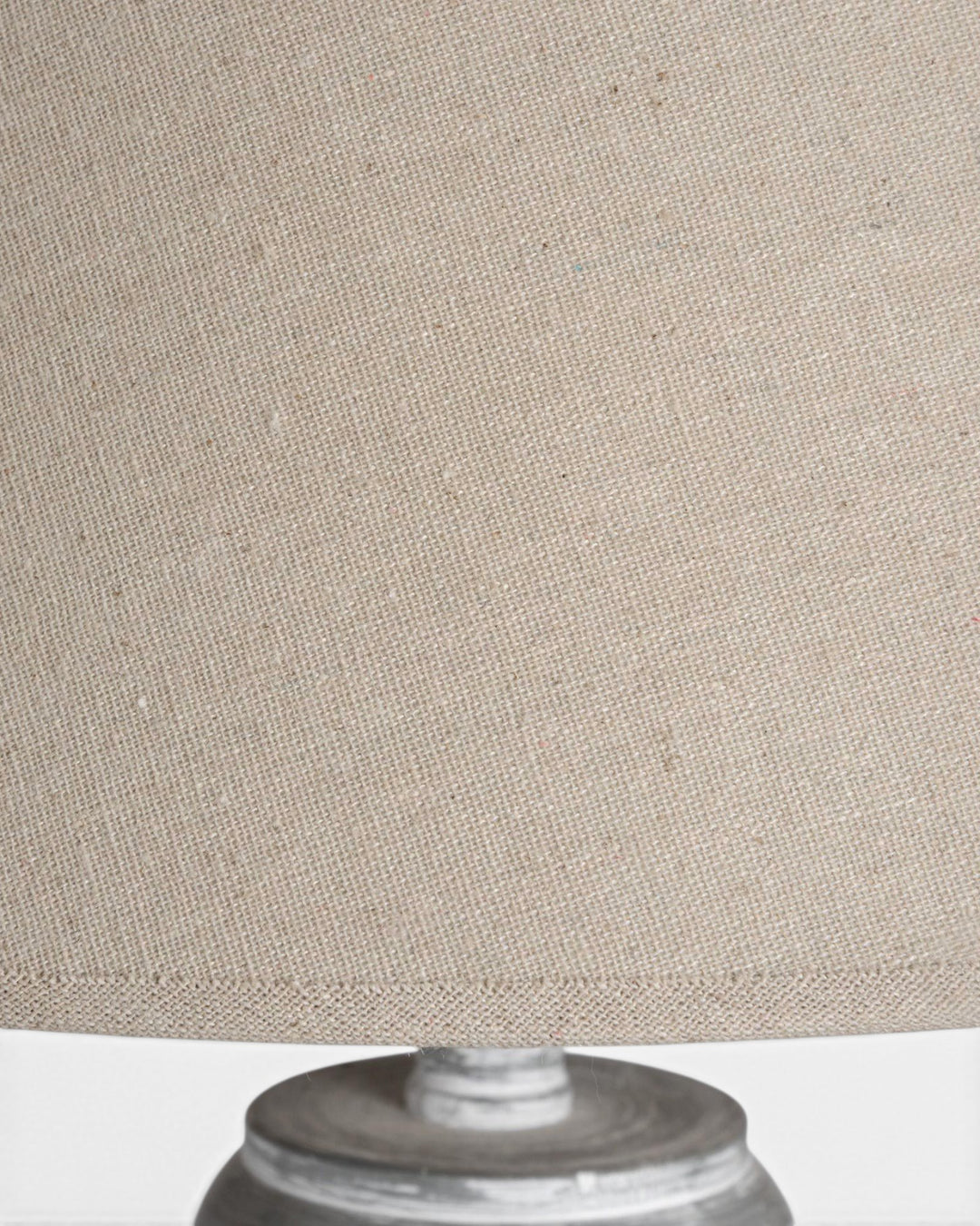 Close-up of a beige lampshade on a white background