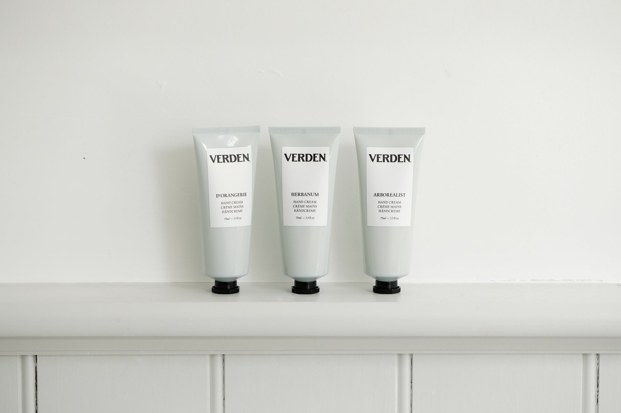 Three Verden skincare products on a white surface with a white background