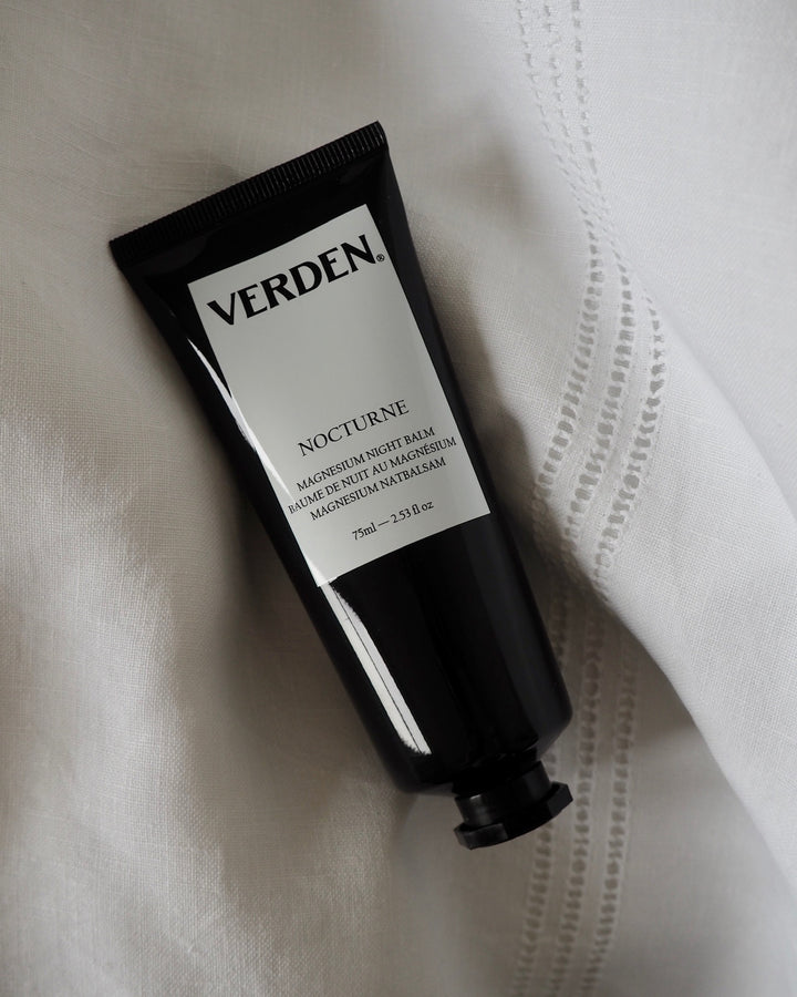 Verden Nocturne balm tube on a white fabric background