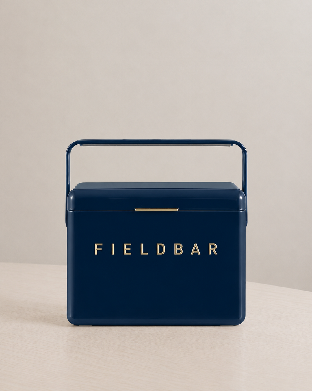 Navy blue cooler box with 'FIELDBAR' branding on a beige background