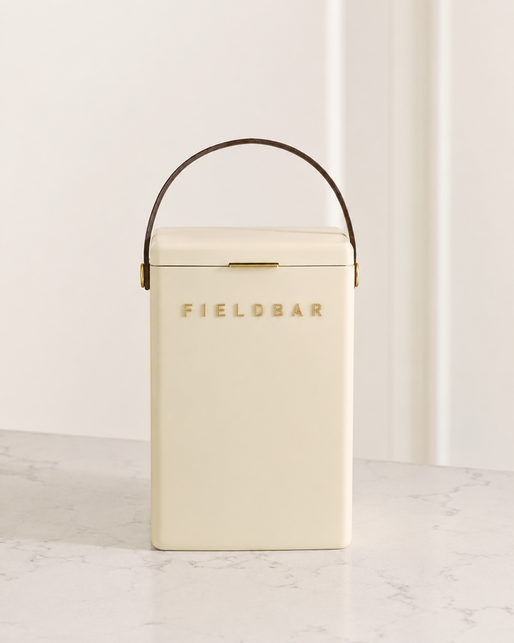 Cream-colored cooler with 'Fieldbar' branding on a light background