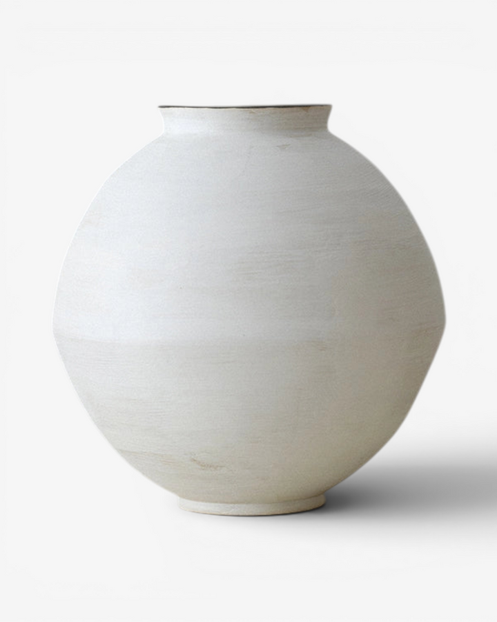 White ceramic vase on a white background