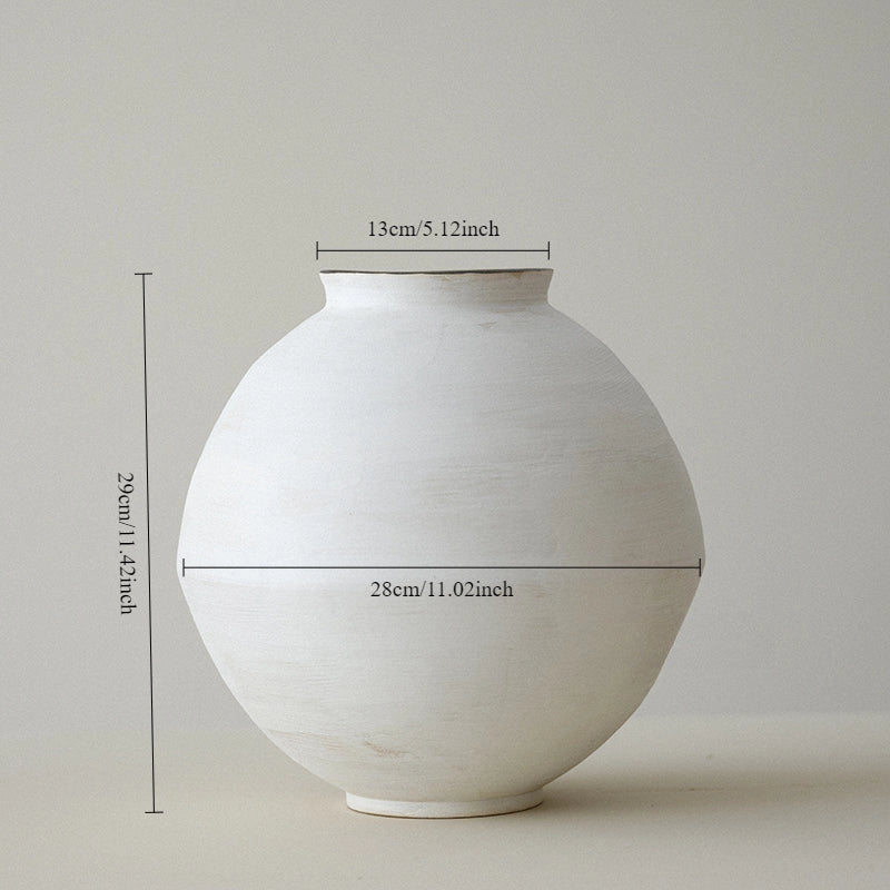 White ceramic vase with measurements on a light gray background