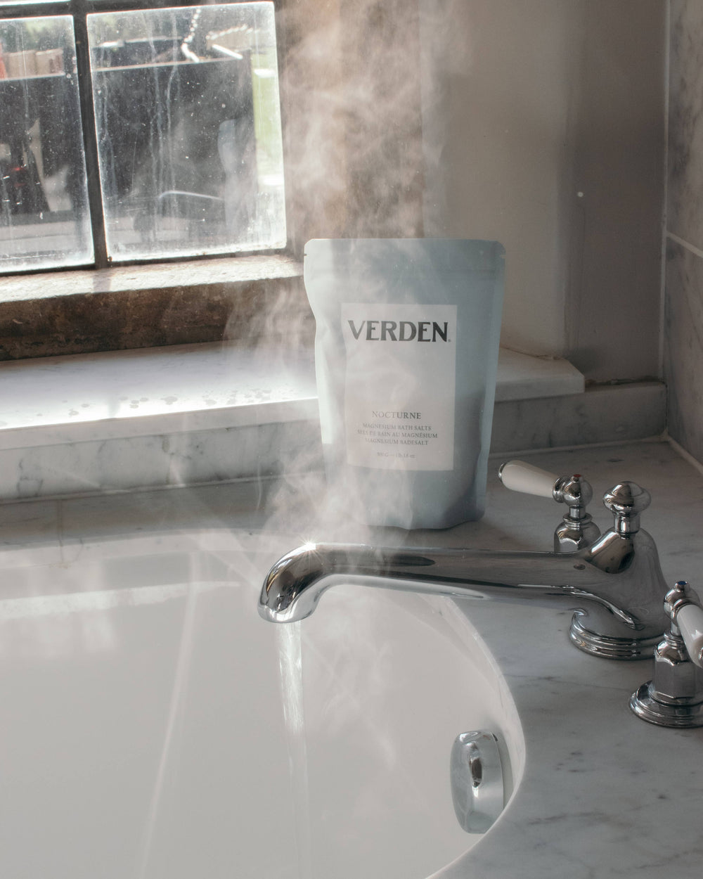 Verden product on a marble sink with steam rising