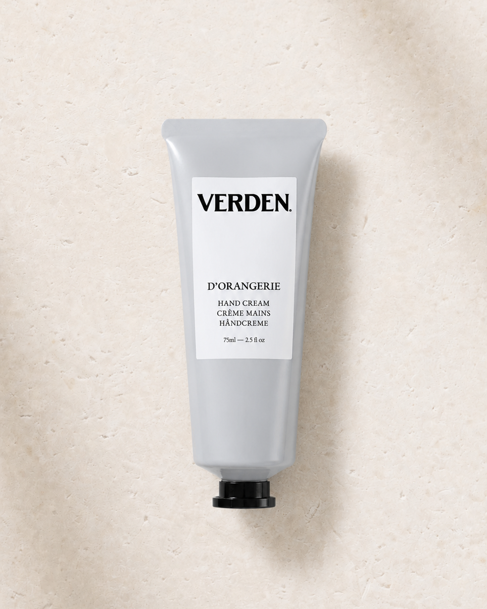 Hand cream tube labeled 'VERDEN' on a textured beige background