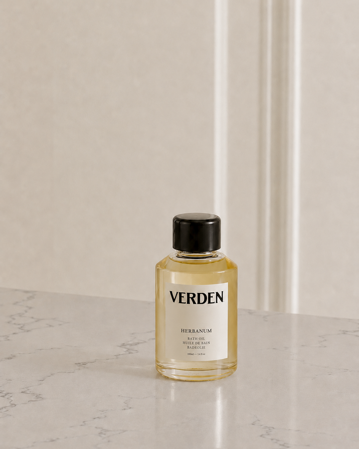 Bottle of Verden product on a marble surface with a neutral background