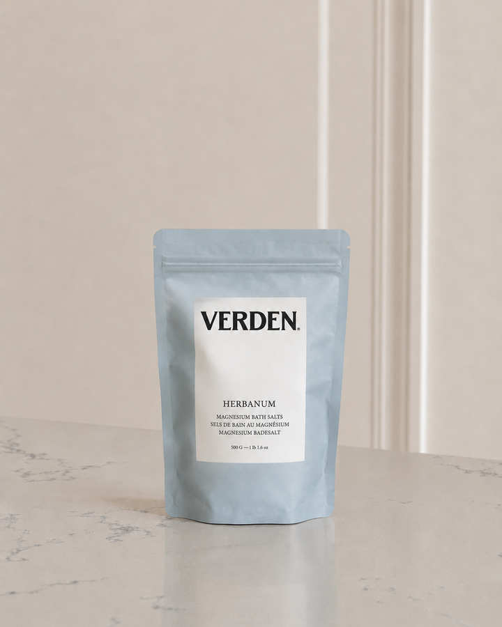 Blue package of Verden bath salts on a light surface with a neutral background