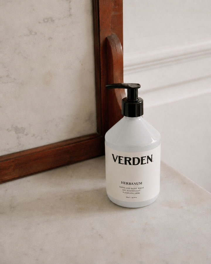 Verden bottle on a marble surface with a mirror in the background